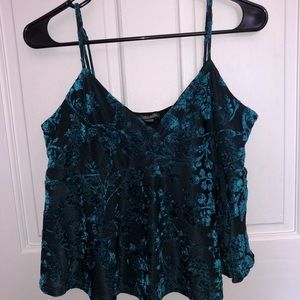 Black top with teal velvet flowers